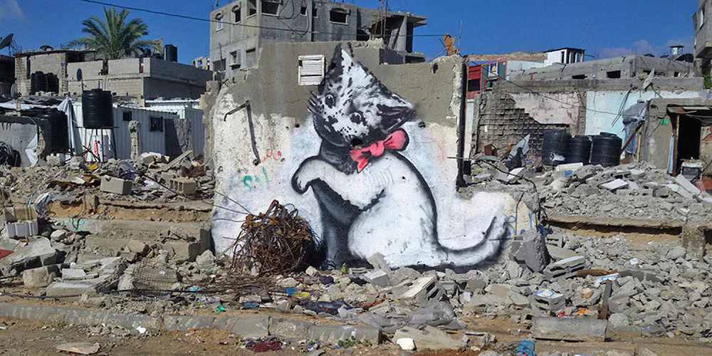 以噴漆狩獵時事，街頭藝術家Banksy_5.jpg